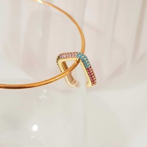 Earcuff "Pixie"  Material: Brass  Color: Gold with multicolored zircon stones  Dimensions  Perimeter: 6 cm  Thickness: 0.4cm  Length x Height: 1.7x2 cm