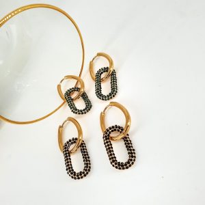 Material: Steel with Brass Color: Gold Zircon stones: Green, Black Dimensions: 1.3 x 4.1 cm