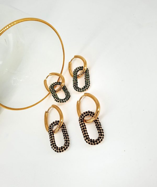 Material: Steel with Brass Color: Gold Zircon stones: Green, Black Dimensions: 1.3 x 4.1 cm
